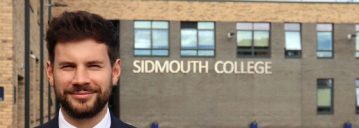 Picture of Alex Evans stood infront of Sidmouth College